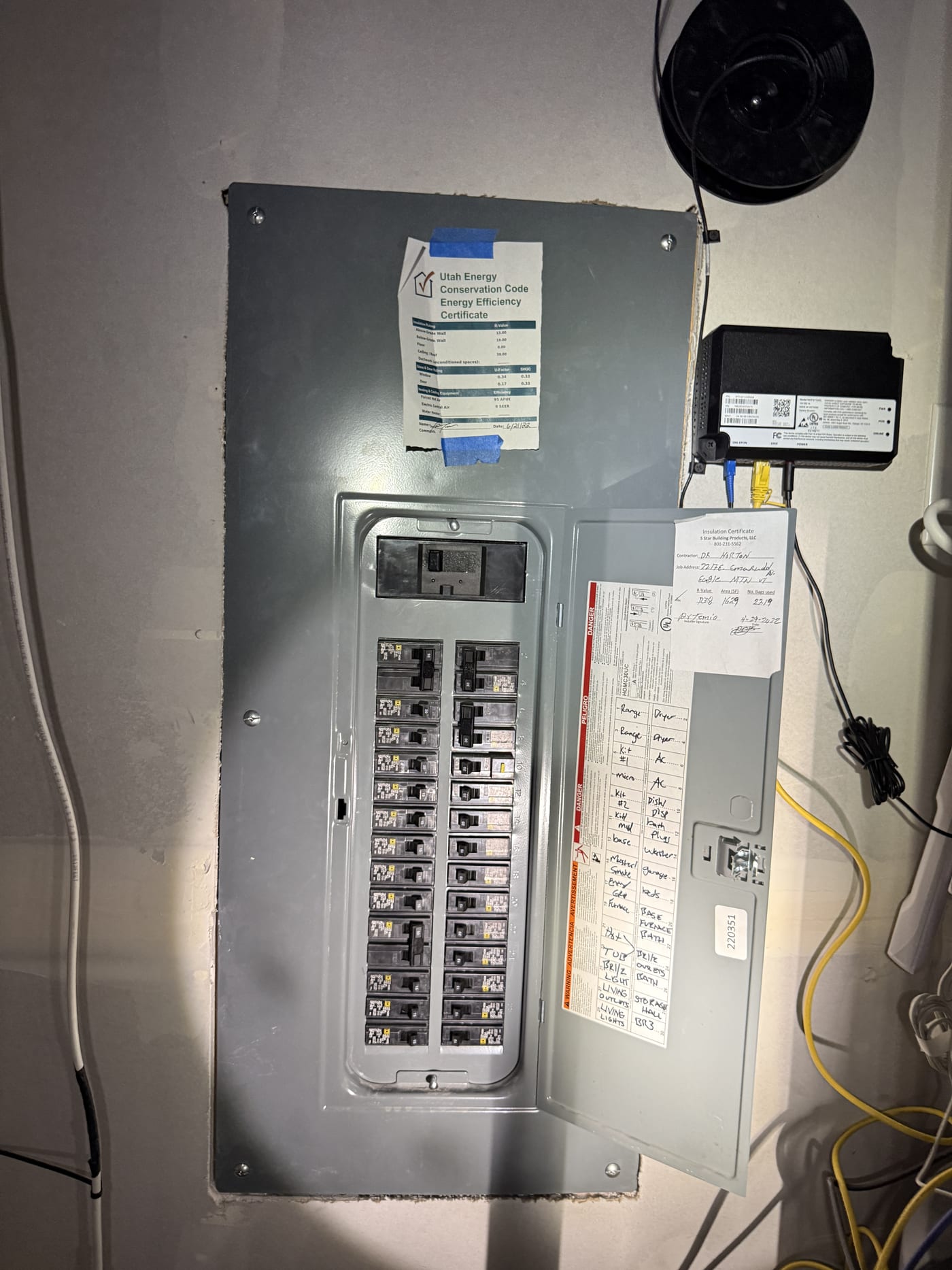 Main breaker panel with cover showing circuit directory and breaker layout