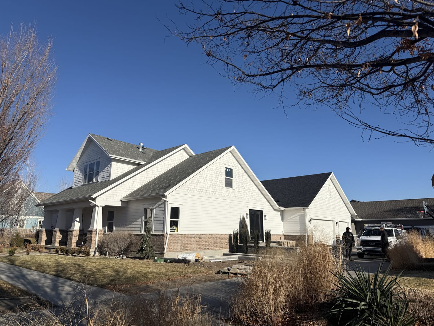 House exterior from street, rotated image, slightly different angle, panels not visible
